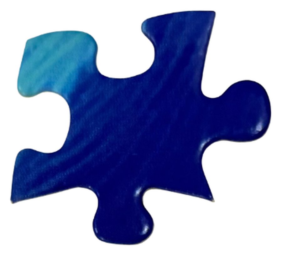 A single Magical Peacock puzzle piece, showing the cut and the printed finish